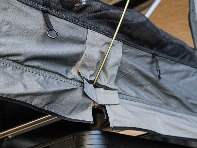 Load image into Gallery viewer, Close-up view of Front Runner Roof Top Tent fabric and tensioning system.