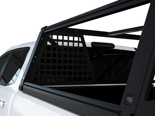 Alt text: inchFront Runner Pro Bed Rack Headache Molle Panel installed on a pickup truck, enhancing vehicle storage capability.inch