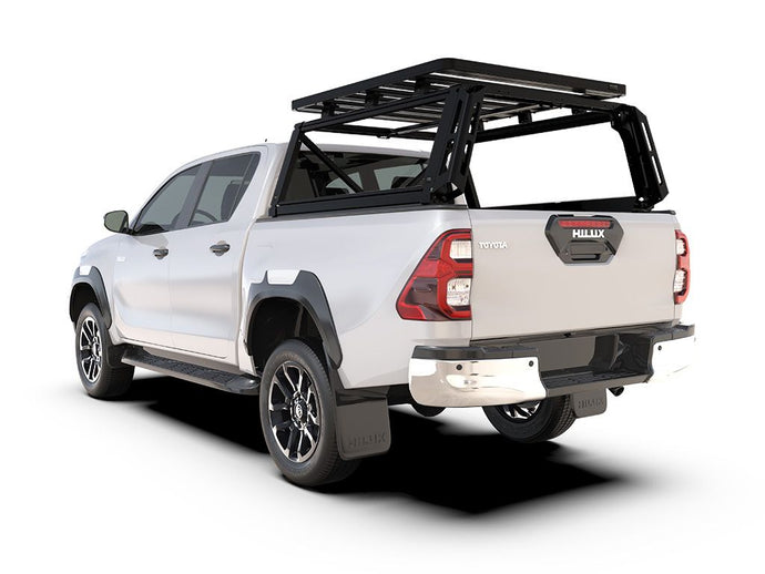 Alt text: inch2016-current Toyota Hilux Revo Double Cab with Front Runner Pro Bed Rack Kit installed on the truck bed, isolated on a white background.inch