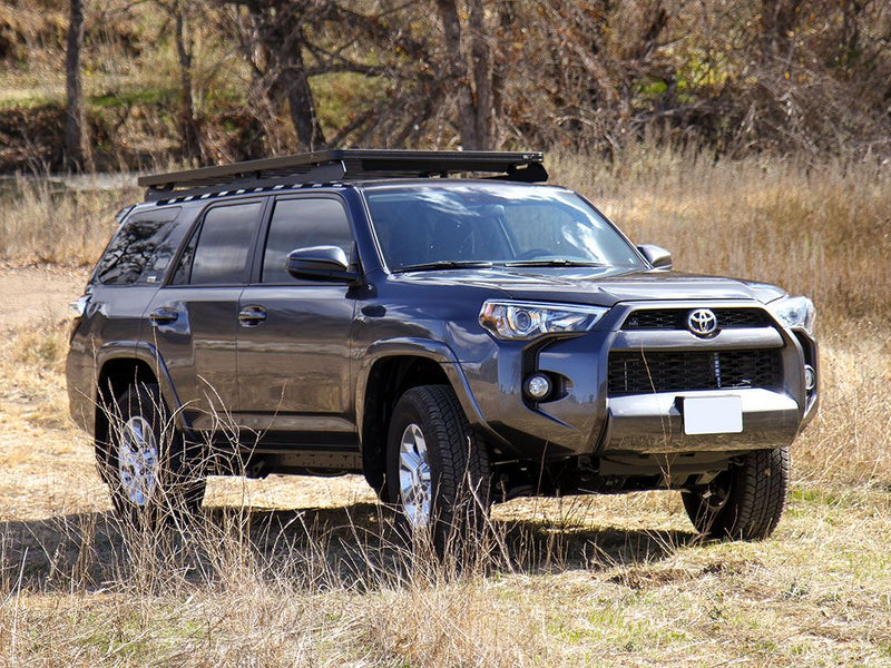 Load image into Gallery viewer, Front Runner Toyota 4Runner 5th Gen with Slimline II Roof Rack Kit installed, parked off-road