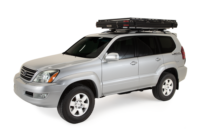Load image into Gallery viewer, Silver SUV with Freespirit Recreation Odyssey Series rooftop tent, black top hard shell mounted on roof.
