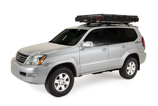 Silver SUV with Freespirit Recreation Odyssey Series rooftop tent, black top hard shell mounted on roof.