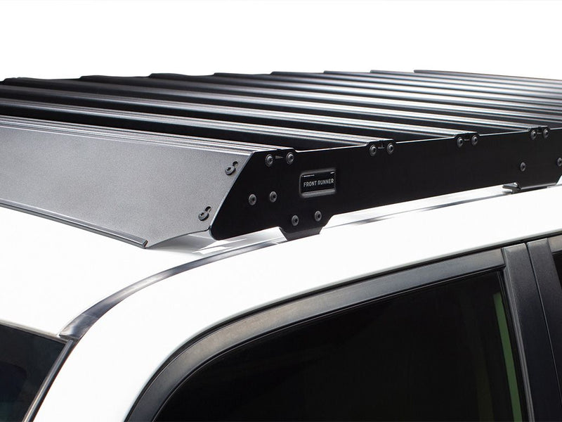 Load image into Gallery viewer, Front Runner Slimsport Roof Rack Kit installed on Toyota 4Runner 2010-current model, close-up side view.
