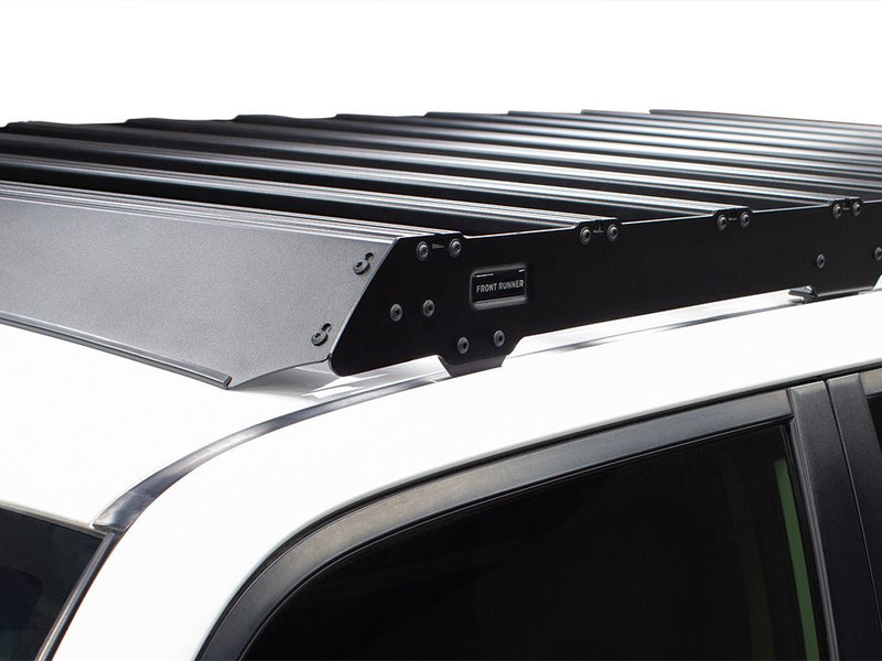Load image into Gallery viewer, Front Runner Slimsport Roof Rack Kit installed on Toyota 4Runner 2010-current model, close-up side view.