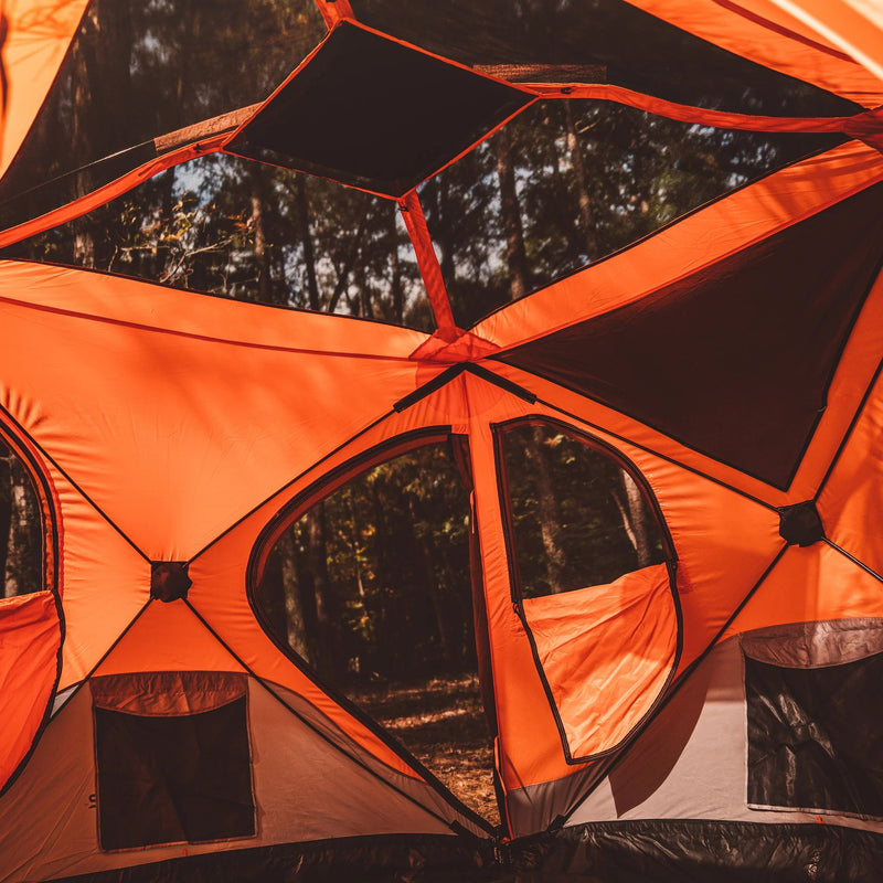 Load image into Gallery viewer, Orange Gazelle T4 Hub Tent setup in forest with open windows showing spacious interior design
