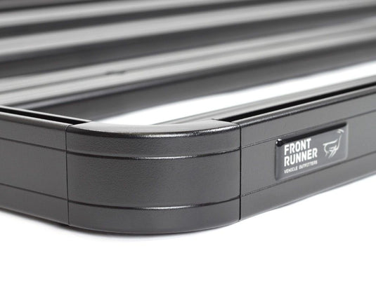 Close-up of Front Runner Slimline II Load Bed Rack Kit for Ford Ranger Pickup Truck model years 1998-2012 with visible brand logo.