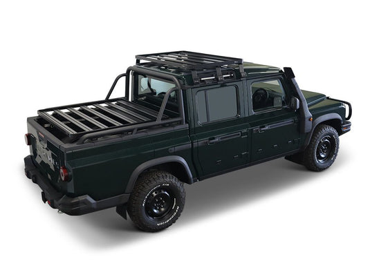 Alt text: inchFront Runner Ineos Grenadier Quartermaster 2023 model equipped with a Slimline II 1/2 Roof Rack Kit, displayed in a studio setting.inch