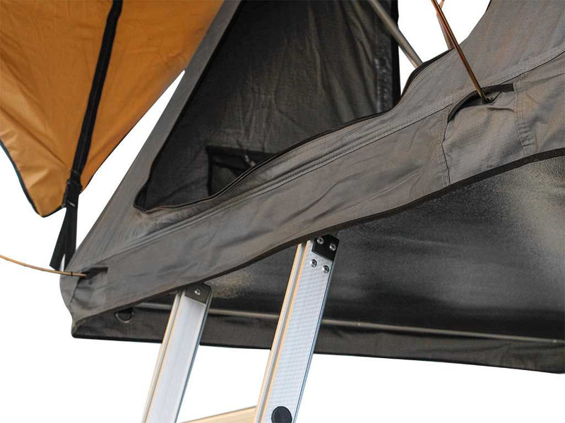 Load image into Gallery viewer, Close-up view of a Front Runner Roof Top Tent showing the open tent fabric and support poles.
