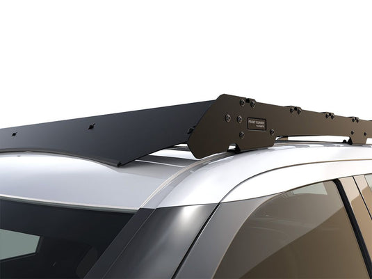 Alt text: "Close-up view of a Front Runner Slimsport Roof Rack Kit installed on a 2022 Toyota Tundra Crew Cab, highlighting the sturdy mounting and sleek design."