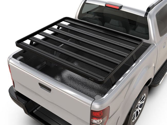 Front Runner Nissan Titan Pickup Truck Slimline II Load Bed Rack Kit installed on a silver 2003 or newer model, enhancing storage capacity and vehicle utility