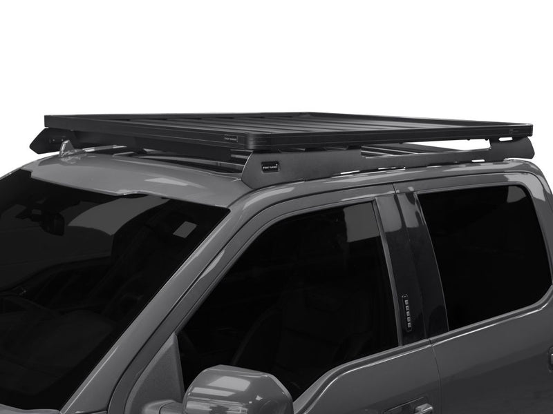 Load image into Gallery viewer, Front Runner Slimline II Roof Rack Kit installed on a 2009-current Ford F150 Crew Cab, showing the sleek design and sturdy build on the vehicle&#39;s roof.
