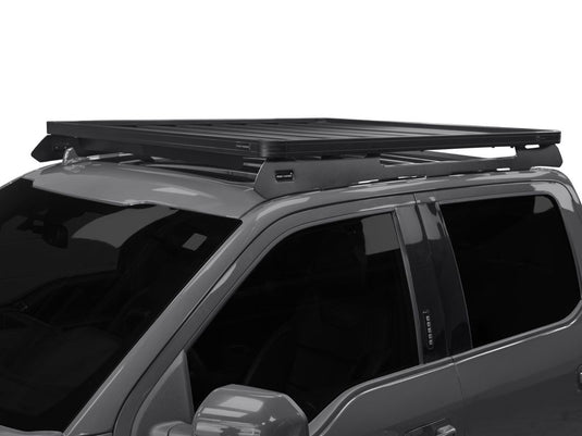 Front Runner Slimline II Roof Rack Kit installed on a 2009-current Ford F150 Crew Cab, showing the sleek design and sturdy build on the vehicle's roof.