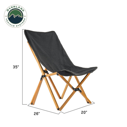 Alt text: "Overland Vehicle Systems Kick It Camp Chair with Wood Base and Black Canvas, including dimensions and storage bag."