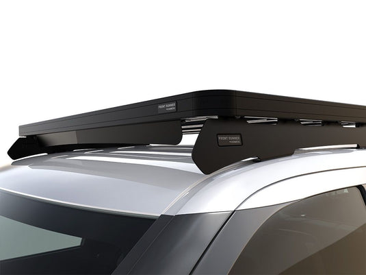 Alt text: "Front Runner Slimline II roof rack kit mounted on a Toyota Tundra 3rd Gen cab-over camper, showcasing low-profile design and durable construction."