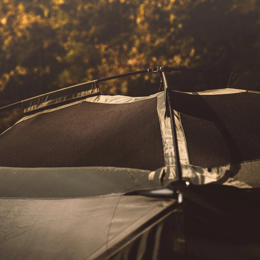 Close-up of a Gazelle T4 Hub Camping Tent set up in the wilderness at dusk.