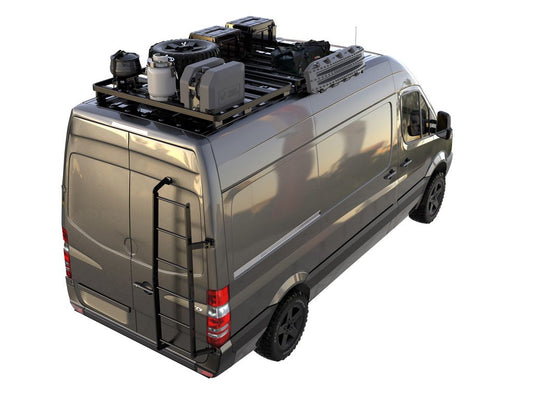 Mercedes Benz Sprinter with Slimline II 1/2 Roof Rack Kit by Front Runner, equipped for off-road and camping, side ladder visible.