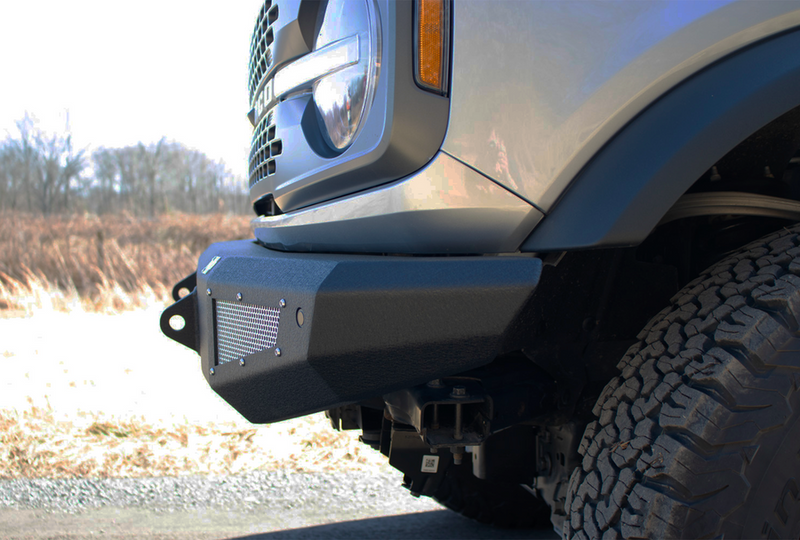 Load image into Gallery viewer, Alt text: &quot;Close-up view of a Fishbone Offroad Steelhead Front Bumper on a 2022 Ford Bronco, showcasing the rugged design and textured black finish.&quot;
