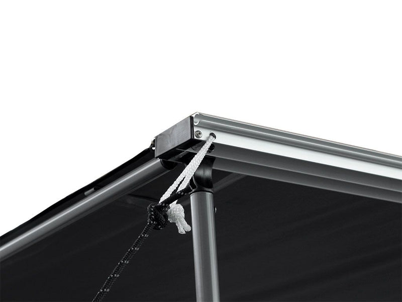 Load image into Gallery viewer, Close-up of Front Runner Easy-Out Awning 1.4M showing the sturdy aluminum frame and retractable canvas material.
