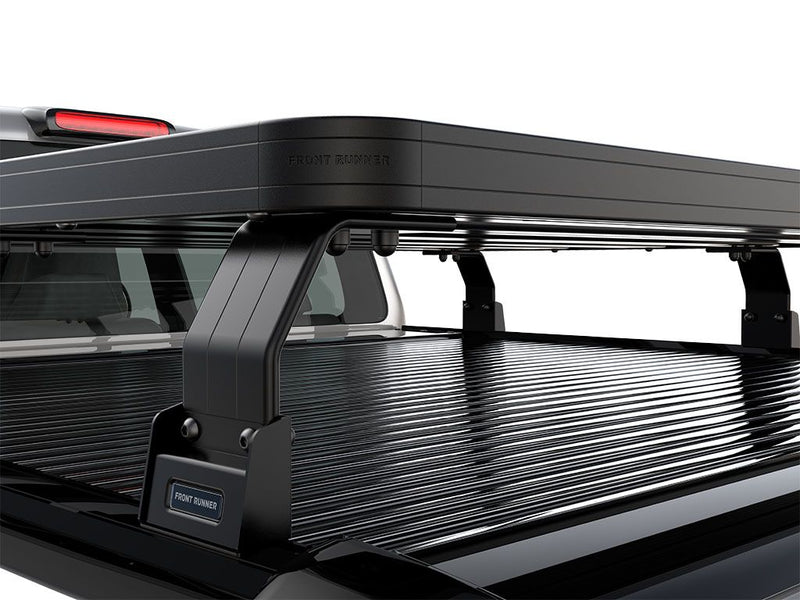 Load image into Gallery viewer, Close-up view of the Front Runner Ford F150 2015-Current Roll Top 6.5&#39; Slimline II Load Bed Rack Kit installed on truck bed.
