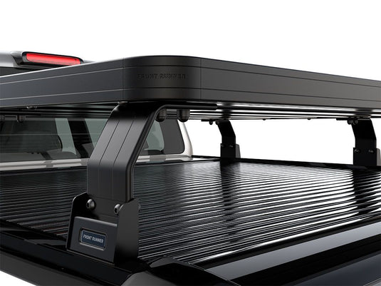 Close-up view of the Front Runner Ford F150 2015-Current Roll Top 6.5' Slimline II Load Bed Rack Kit installed on truck bed.