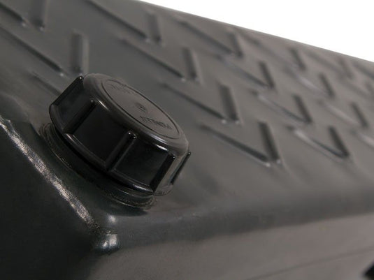 Close-up of the black cap on a Front Runner Footwell Water Tank, showing textured surface detail for vehicle water storage solutions.