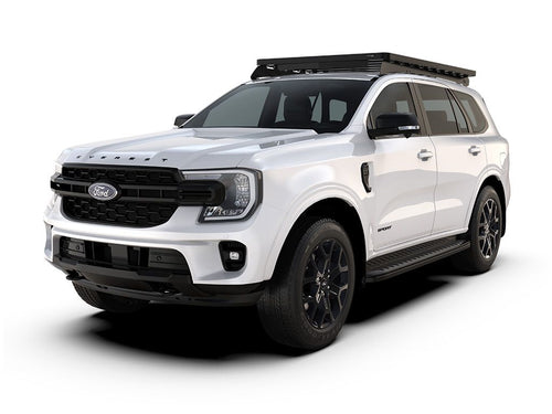 White Ford Everest 2022 with Slimline II Roof Rack Kit by Front Runner installed, side view.