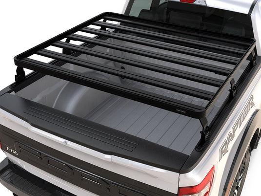 Front Runner Ford F150 Raptor Slimline II Load Bed Rack Kit installed on 5.5 foot truck bed, 2009-current model, view from the rear angle.