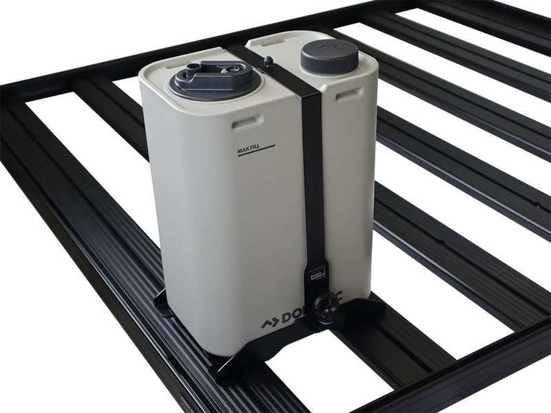 Load image into Gallery viewer, Alt text: &quot;Front Runner Dometic 11L water jug with hydration rack bracket mounted on black vehicle roof rack, featuring secure strap and easy-fill lid.&quot;
