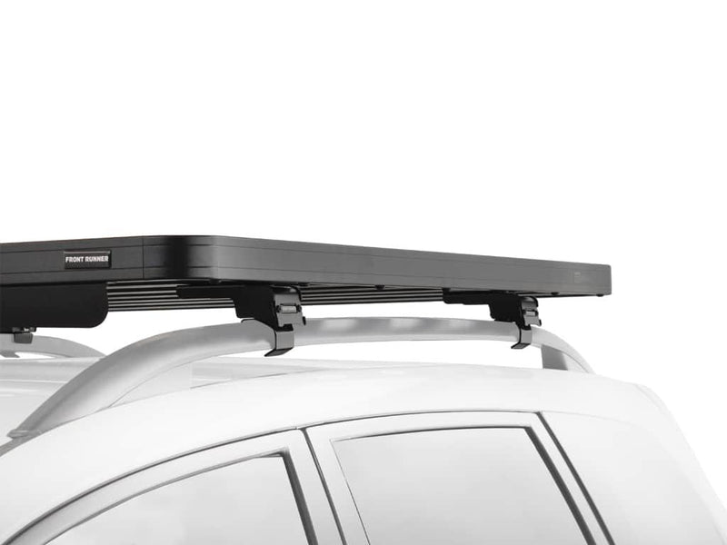 Load image into Gallery viewer, Front Runner Slimline II Roof Rack mounted on a white Jeep Grand Cherokee, model years 1999 to 2010, showing detail of the roof rail rack kit.

