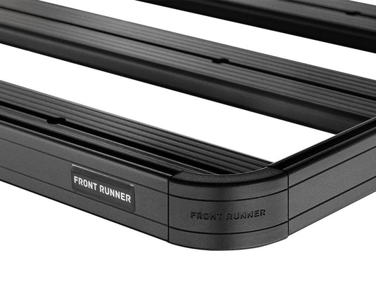 Close-up of Front Runner Slimline II Load Bed Rack Kit for GMC Sierra 1500 Short Bed, featuring durable construction with the brand logo.