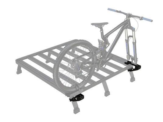 Front Runner Load Bed Rack Side Mount with mounted mountain bike, ideal for vehicle bike carrying solutions