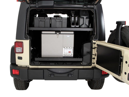 Interior cargo storage rack installed in a Jeep Wrangler JKU 4-Door, showcasing organized compartmentalized space for gear and supplies.