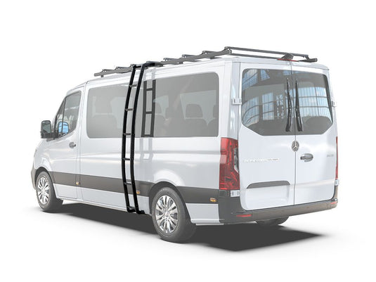 Alt text: "Mercedes-Benz Sprinter with Front Runner Slimpro H1 Van Rack and ladder accessory installed on the side and roof, white background."