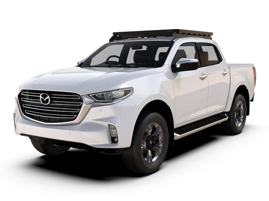 Alt text: "Mazda BT50 2020 with Front Runner Slimline II Roof Rack Kit Low Profile installation on white pickup truck"