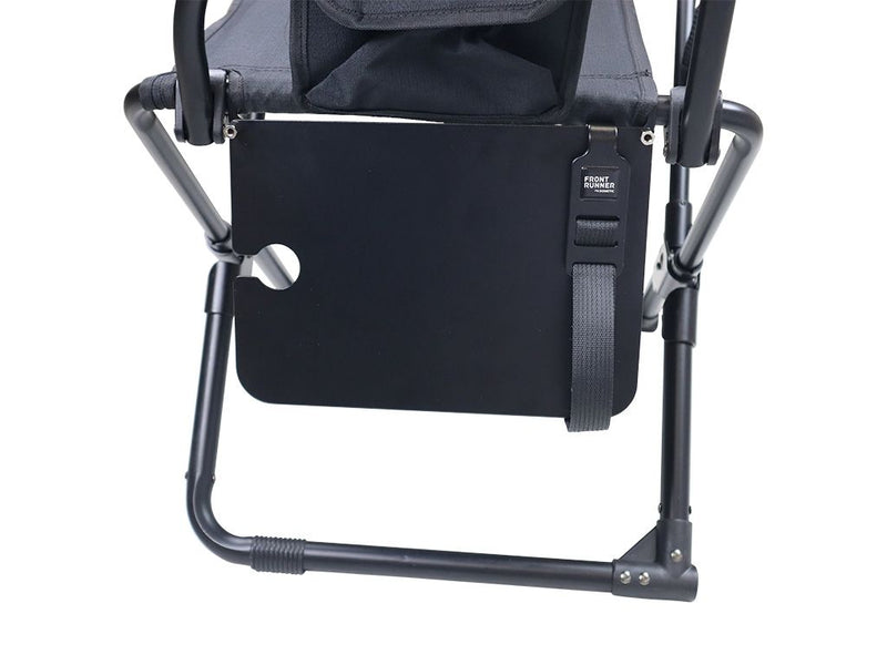 Load image into Gallery viewer, Alt text: &quot;Close-up view of the black Front Runner Expander Chair Side Table attached to a camping chair with logo visible.&quot;
