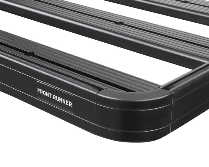 Front Runner GMC Sierra 1500 Short Bed Slimline II Load Bed Rack Kit close-up showing durable black coating and logo.