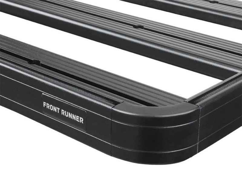 Load image into Gallery viewer, Front Runner GMC Sierra 1500 Short Bed Slimline II Load Bed Rack Kit close-up showing durable black coating and logo.
