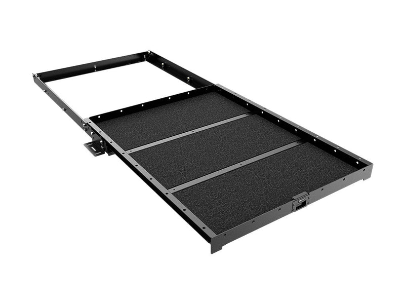 Load image into Gallery viewer, Front Runner small load bed cargo slide extended, featuring a non-slip surface and heavy-duty frame for vehicle organization.
