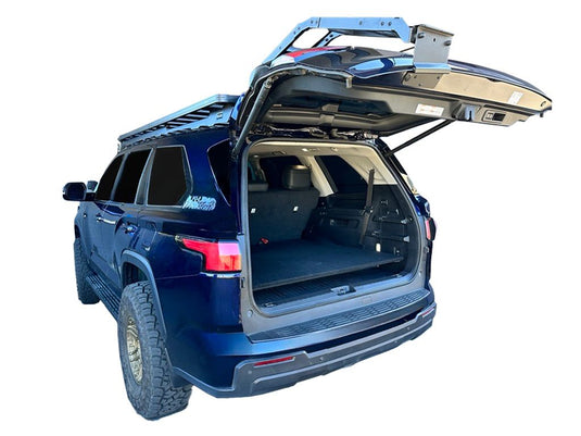 2023 Toyota Sequoia with Front Runner base deck storage system installed, showing open trunk and cargo space