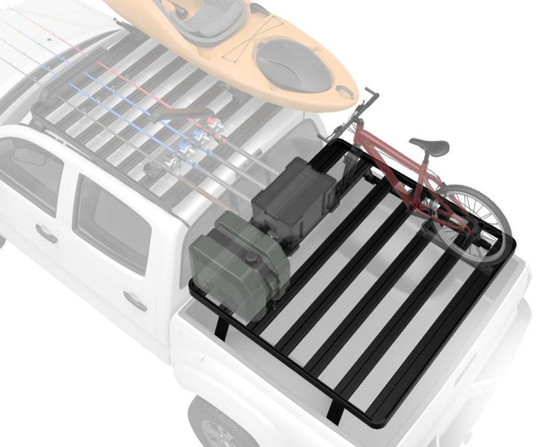 Load image into Gallery viewer, GMC Canyon pickup truck outfitted with the Front Runner Slimline II Load Bed Rack Kit featuring a kayak and bicycle mounted on the rack.
