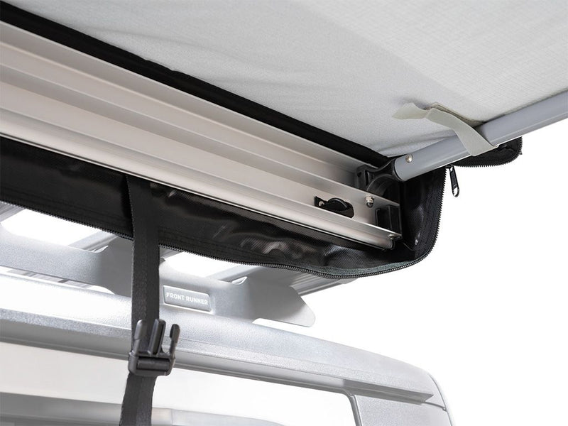 Load image into Gallery viewer, Front Runner Easy-Out Awning 1.4M mounted on vehicle showing detailed view of awning attachment and retractable functionality.
