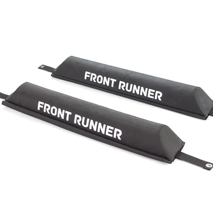 Load image into Gallery viewer, Front Runner rack pad set for vehicle roof racks showing brand logo on black cushioned material with securing straps.
