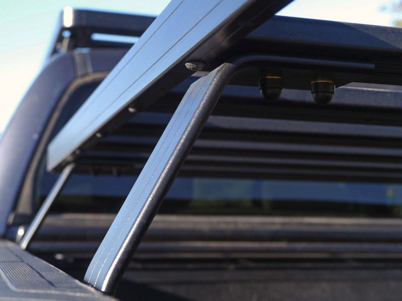 Load image into Gallery viewer, Close-up view of the Front Runner Slimline II Load Bed Rack Kit installed on Toyota Tundra Crew Max_PICK_UP_TRUCK 2007-Current
