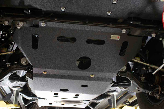 Alt text: inchFishbone Offroad Skid Plates installed on 2016 Toyota Tacoma undercarriage for enhanced protection while off-roading.inch