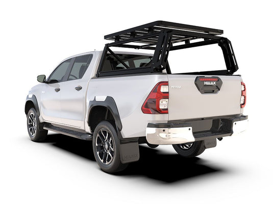 Alt text: "2016-current Toyota Hilux Revo Double Cab with Front Runner Pro Bed Rack Kit installed on the truck bed, isolated on a white background."