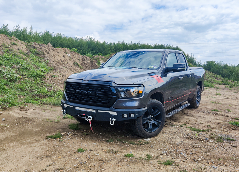 Load image into Gallery viewer, 2019 Ram 1500 equipped with Fishbone Offroad Pike Winch Plate parked outdoors

