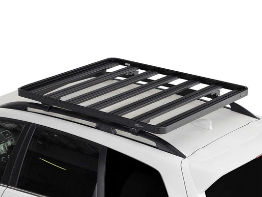 Front Runner Slimline II Roof Rail Rack Kit installed on a white Subaru Forester, model years 2013-Current.