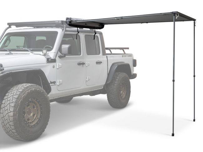 Load image into Gallery viewer, Front Runner Easy-Out Awning 1.4M mounted on white Jeep displaying extendable shade for vehicle camping and outdoor activities
