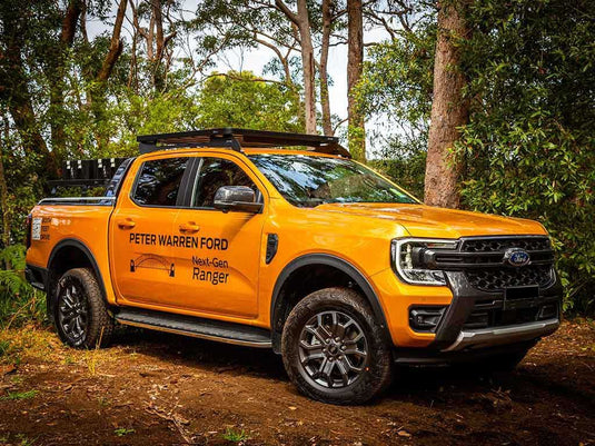 Alt text: "2022 Ford Ranger T6.2 Double Cab equipped with Front Runner Slimline II Roof Rack Kit, showcased in a forest setting"