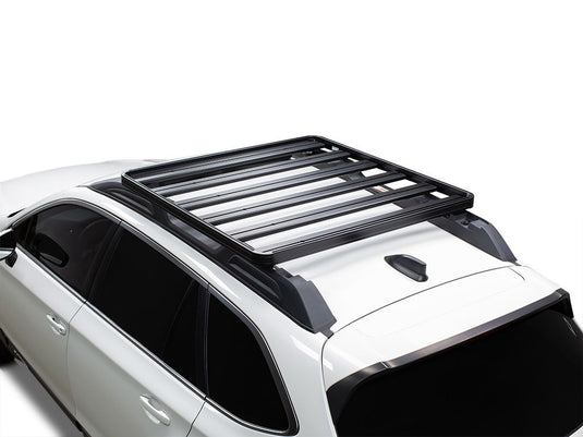 Front Runner Subaru Outback 2015-2019 Slimline II Roof Rail Rack Kit installed on white vehicle rooftop.